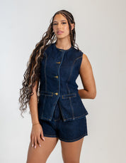 Women's sleeveless denim vest and high-waisted denim shorts set with gold button details.