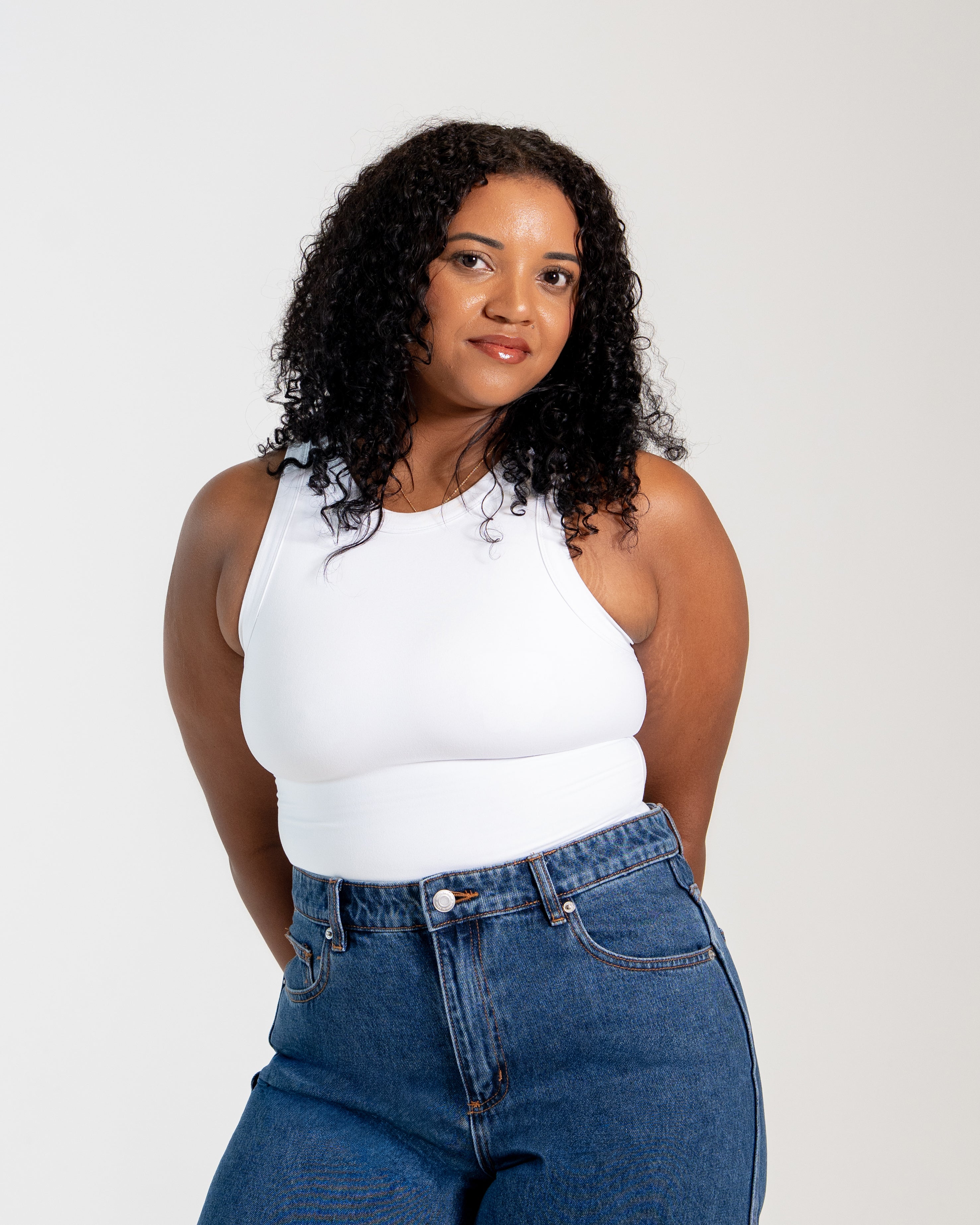 Women's two-layer no-bra tank top with built-in support and flattering silhouette.