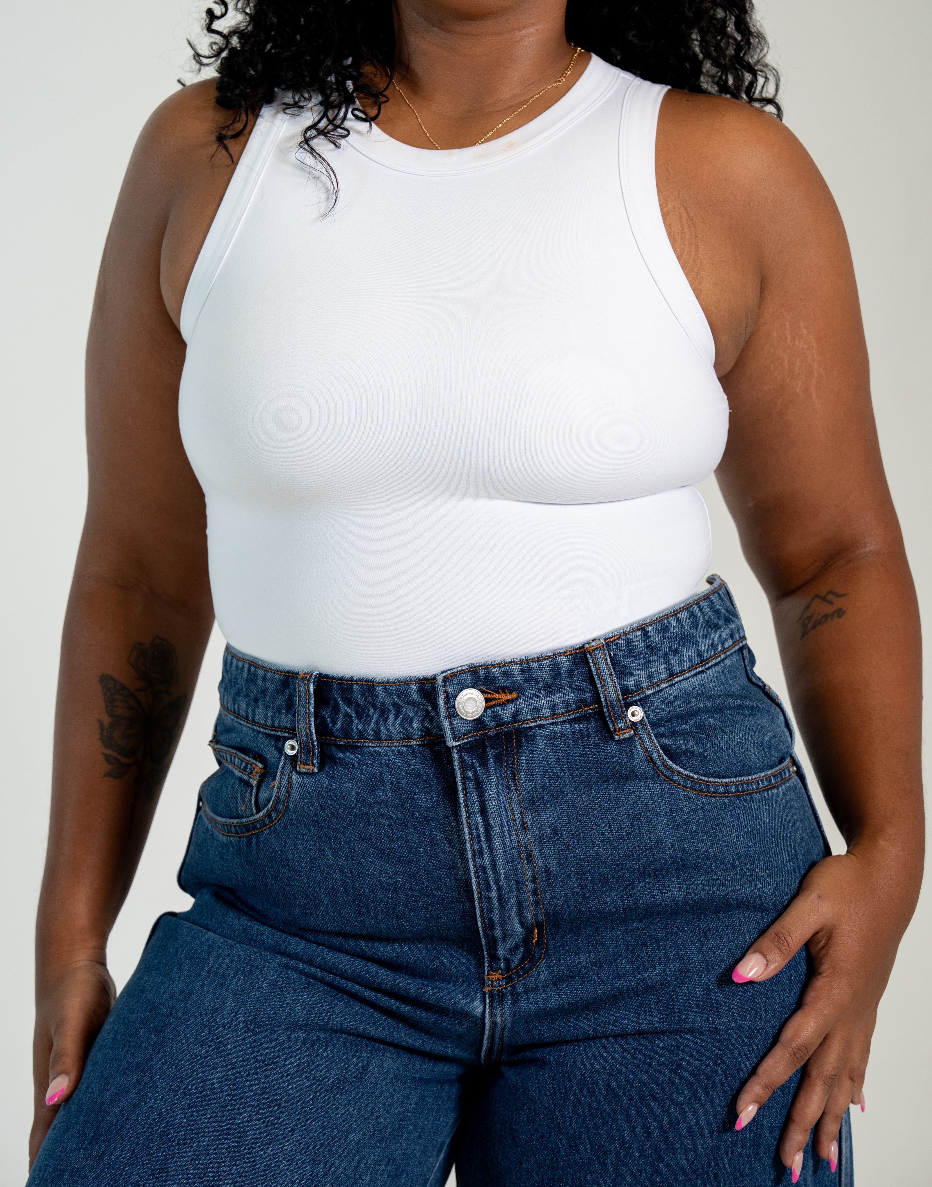 Women's two-layer no-bra tank top with built-in support and flattering silhouette.