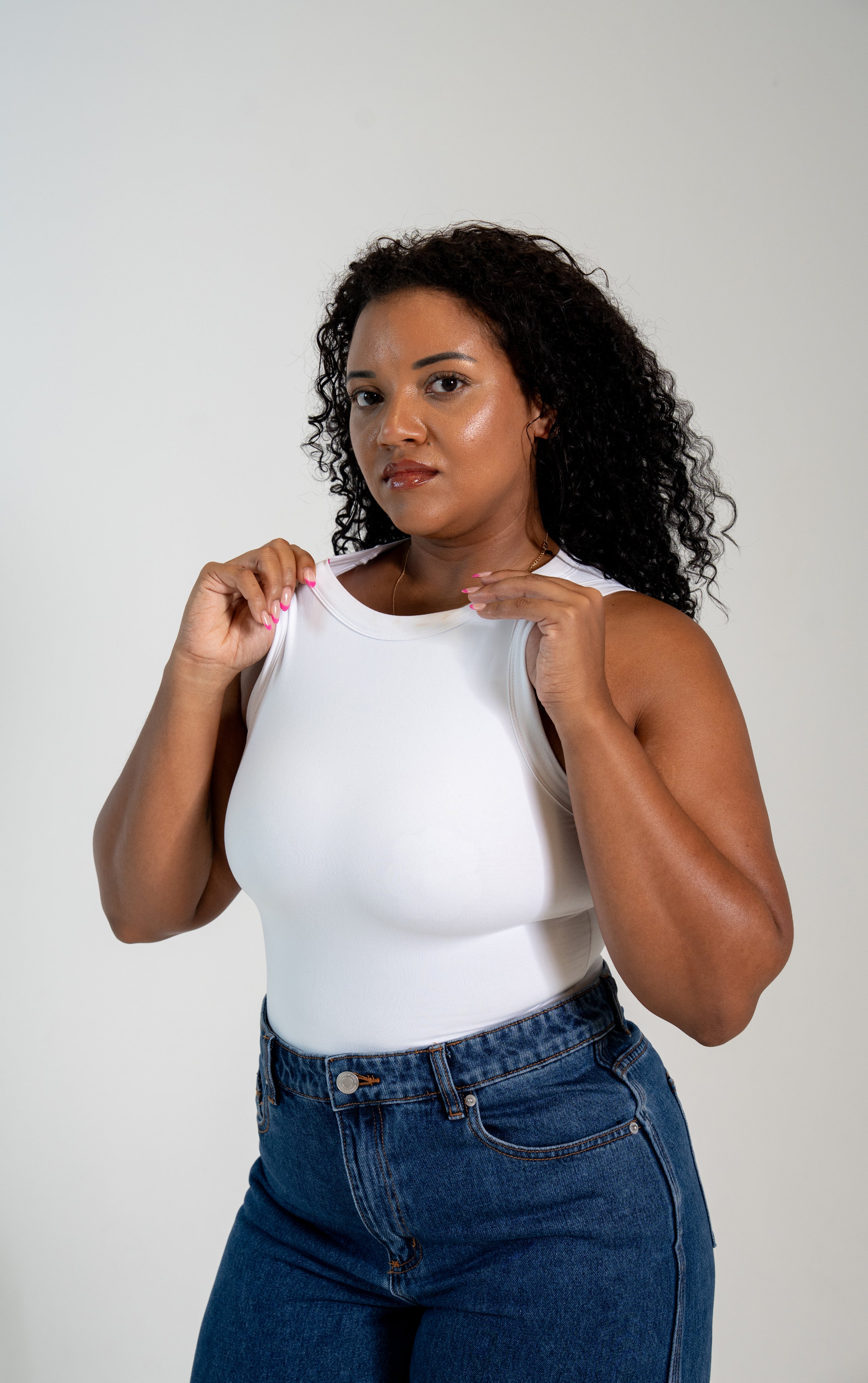 Women's two-layer no-bra tank top with built-in support and flattering silhouette.