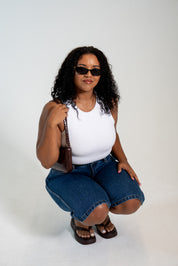 Women's two-layer no-bra tank top with built-in support and flattering silhouette.