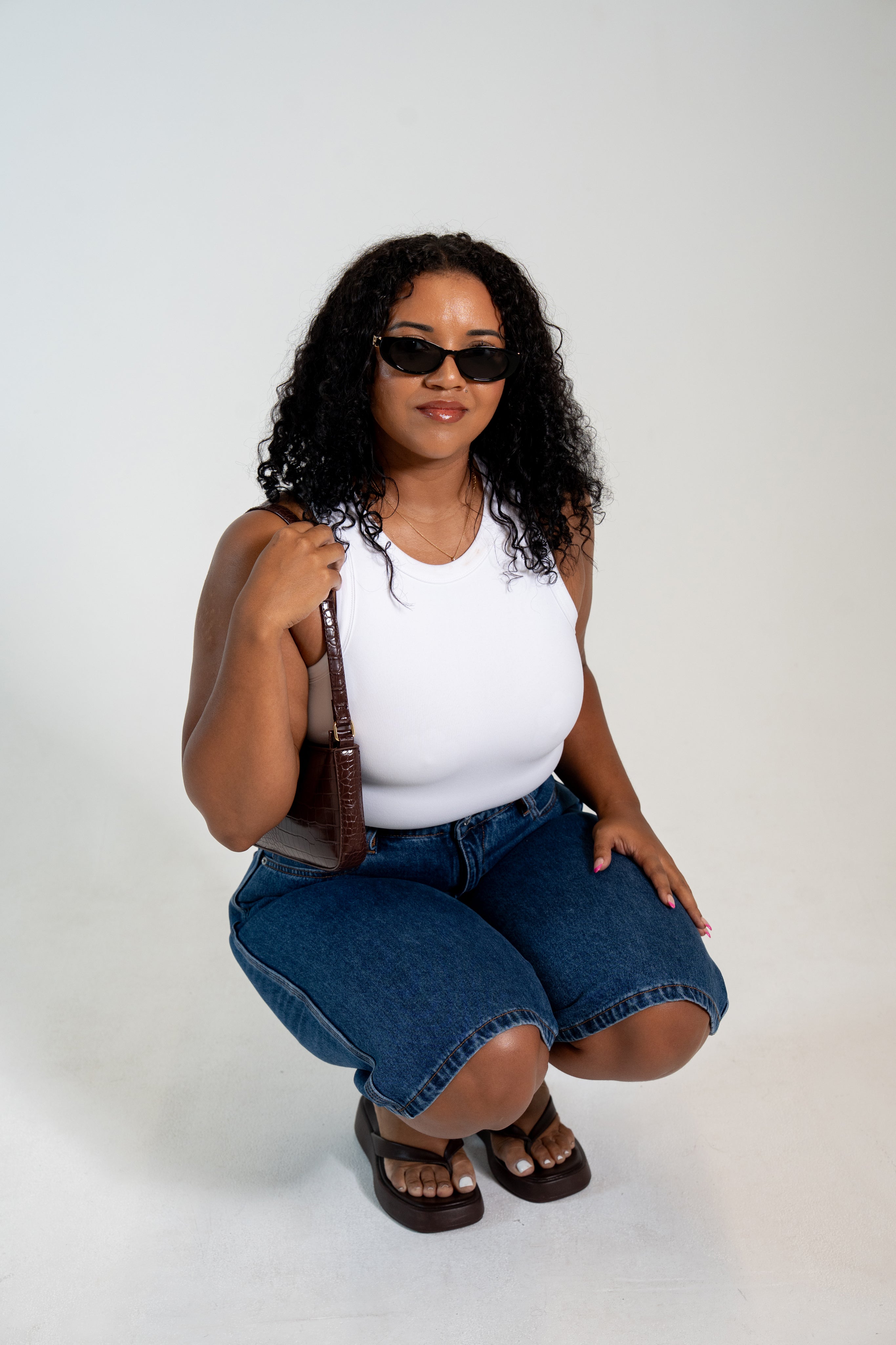 Women's two-layer no-bra tank top with built-in support and flattering silhouette.